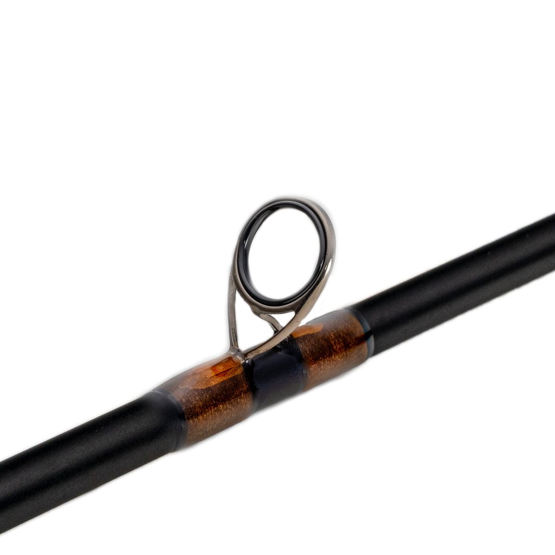 Close-up of a fly rod's ring guide seated on burnt-orange thread wraps over a matte black blank, the finish a spiral protects (photo: Diamondback)