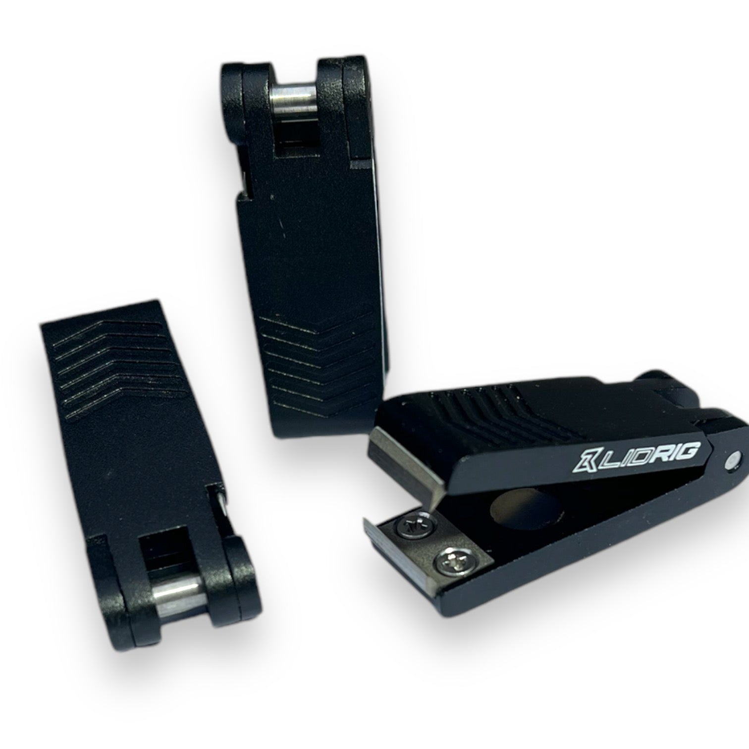 Three matte-black Lid Rig 3.0 nippers on a white background, open and closed, showing the magnetic cutter head and textured grip (photo: Lid Rig)