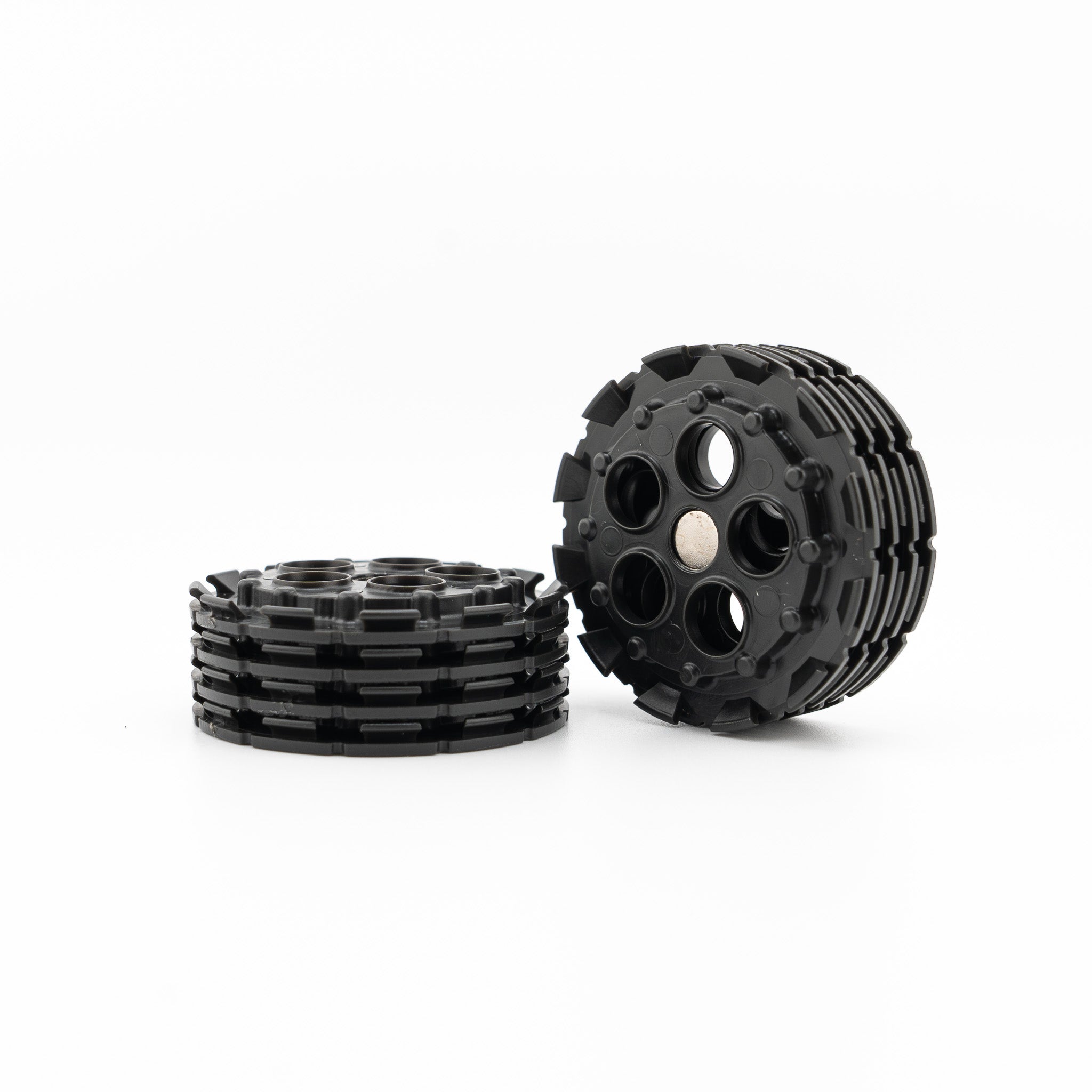 A stack of bare QuickDrift Drift Spools, showing the magnetic hub each rig winds onto (photo: Flytime Fishing)